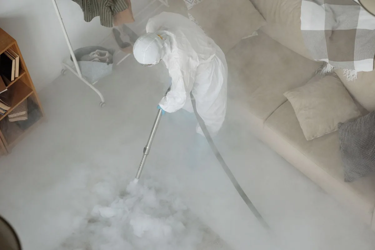 Biohazard cleanup technician in protective equipment, Panguitch, UT